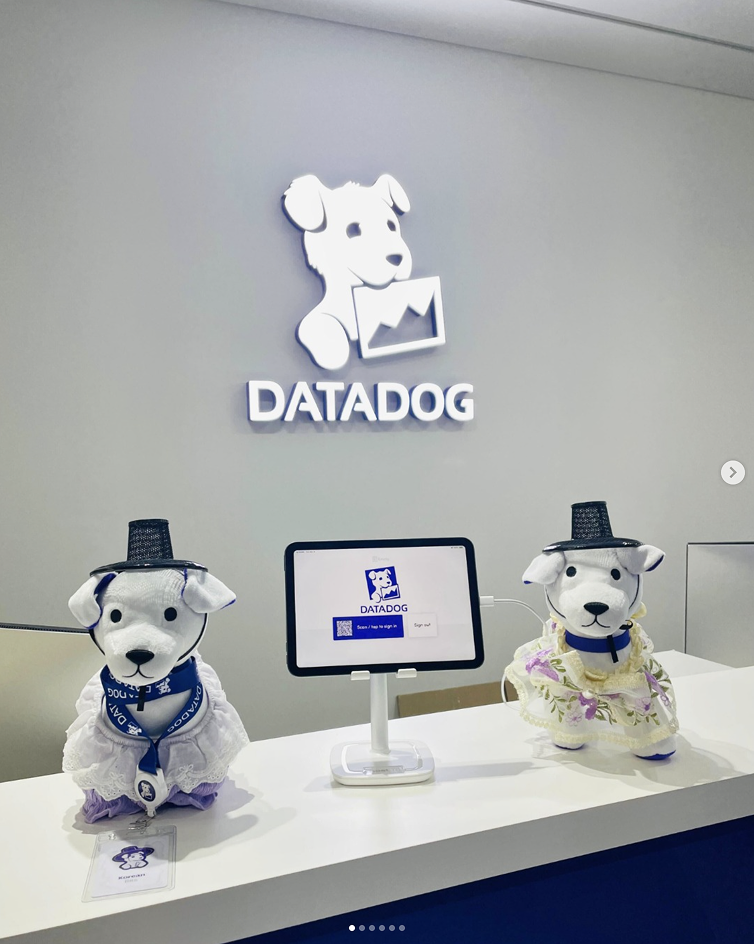 Two Bits plushies in top hats at Datadog office reception desk